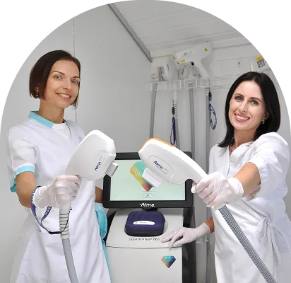 wo aesthetic healthcare professionals holding advanced skin treatment devices in a modern clinic
