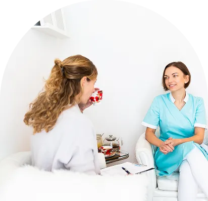 Healthcare professional consulting with a patient during a therapy session