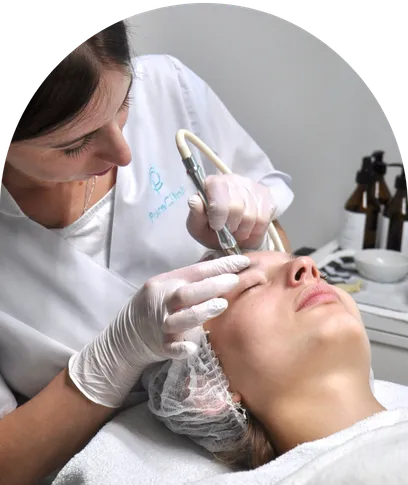 PureClinic professional performing a precision skin treatment on a client