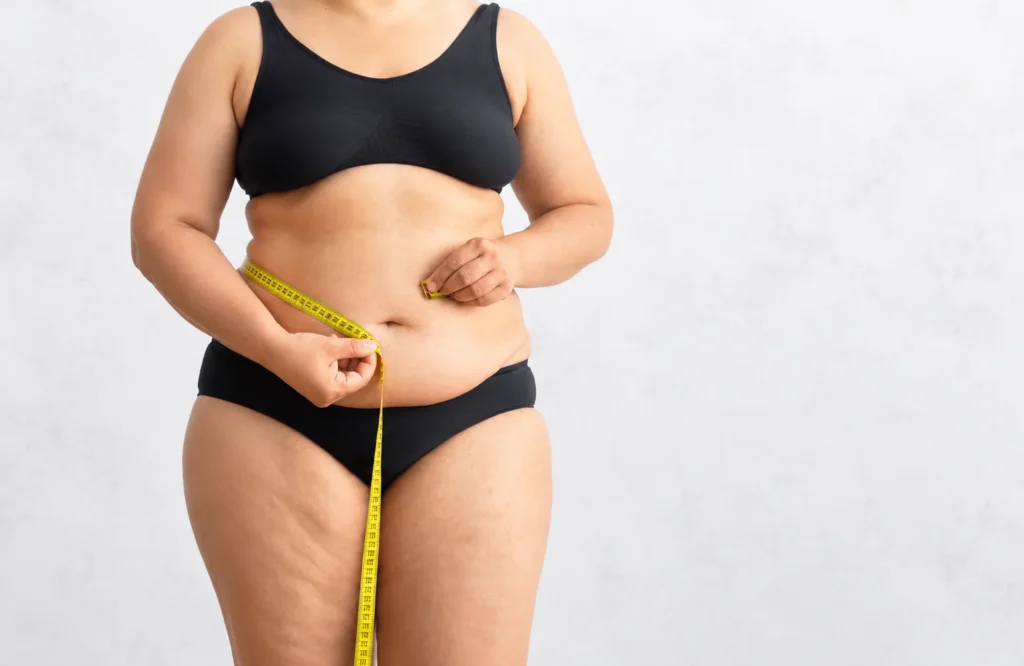 Plus-Size Woman Measuring Waist