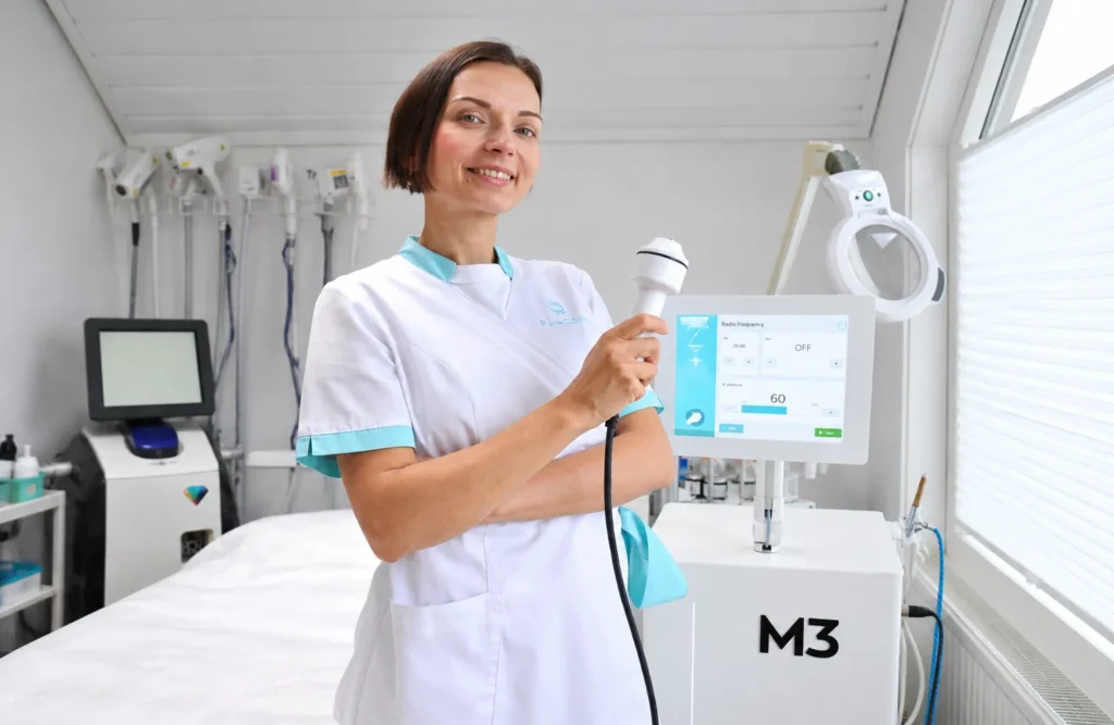Smiling Technician in Radio Frequency Clinic